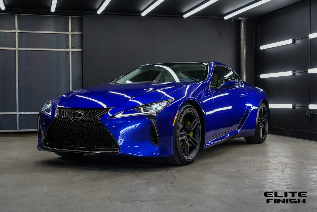 Lexus LC500 Blue parked under the lighting booth at Elite Finish San Diego