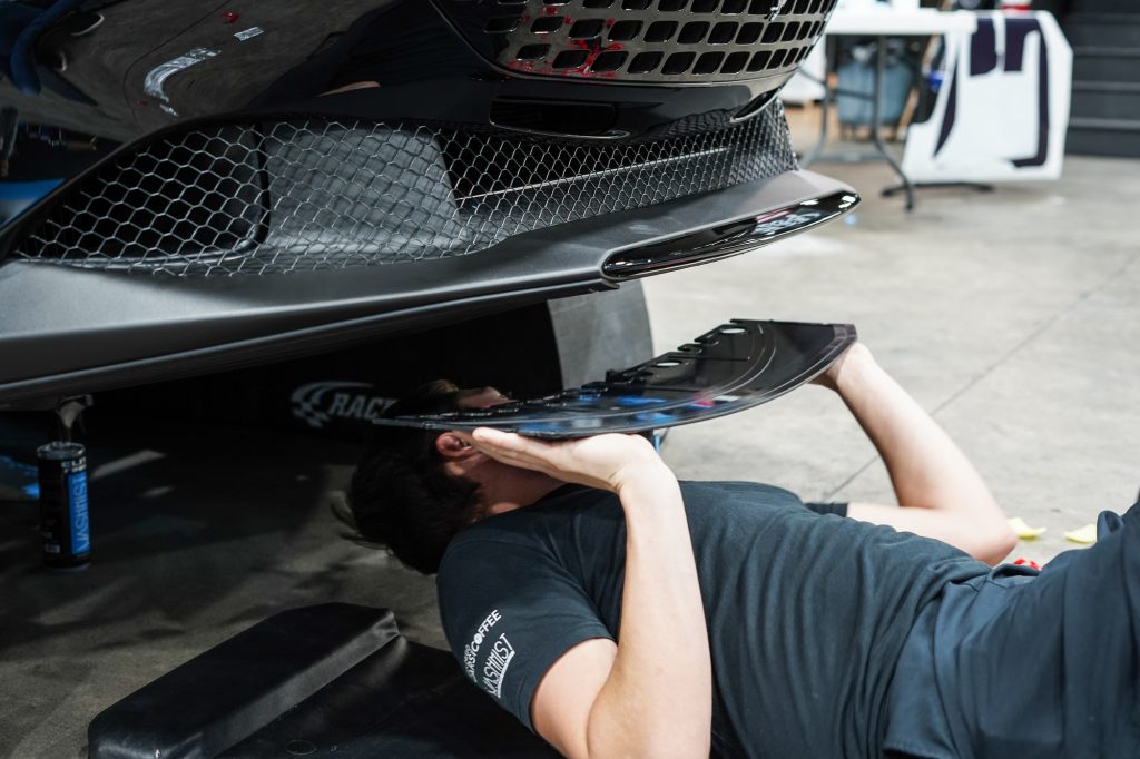 Automods skid plate installation on a ferrari at elite finish.